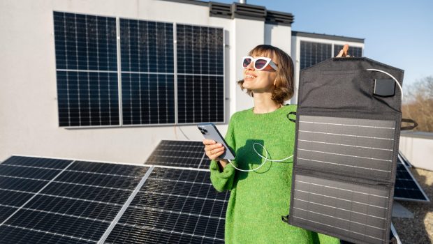 woman-charging-phone-from-a-solar-portable-panel-2023-11-27-04-48-53-utc (1)